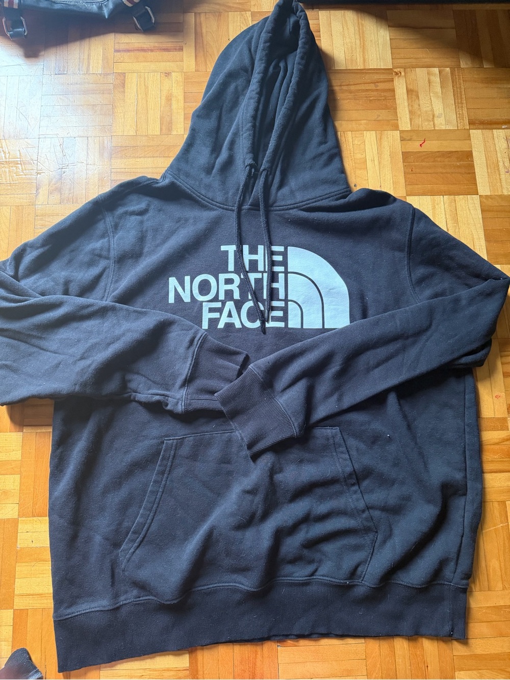 The North Face Black Pullover Hoodie with white Logo